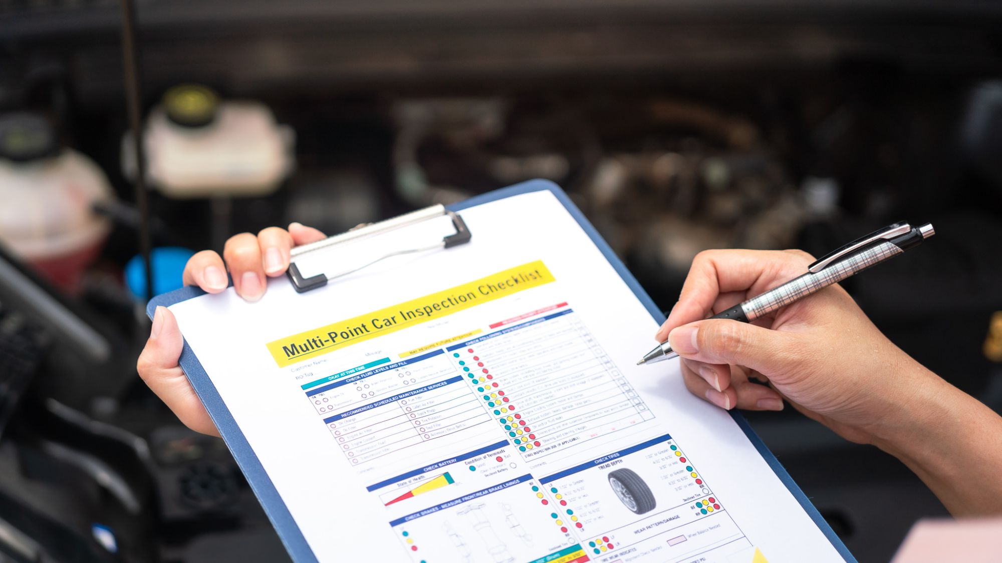 Mechanic Holding Clipboard